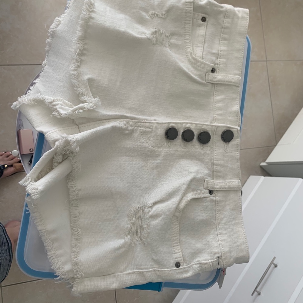 White ripped jean shorts